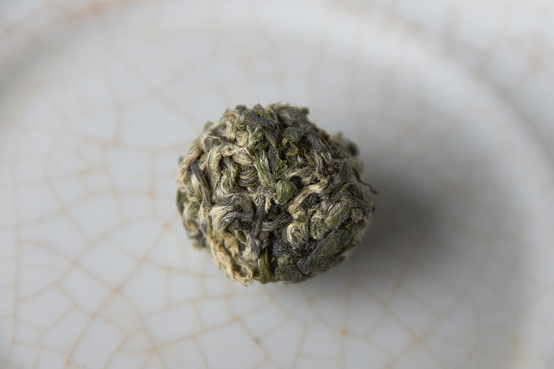 Hand-rolled Green Tea Balls - Lei Shan Yin Qiu closeup